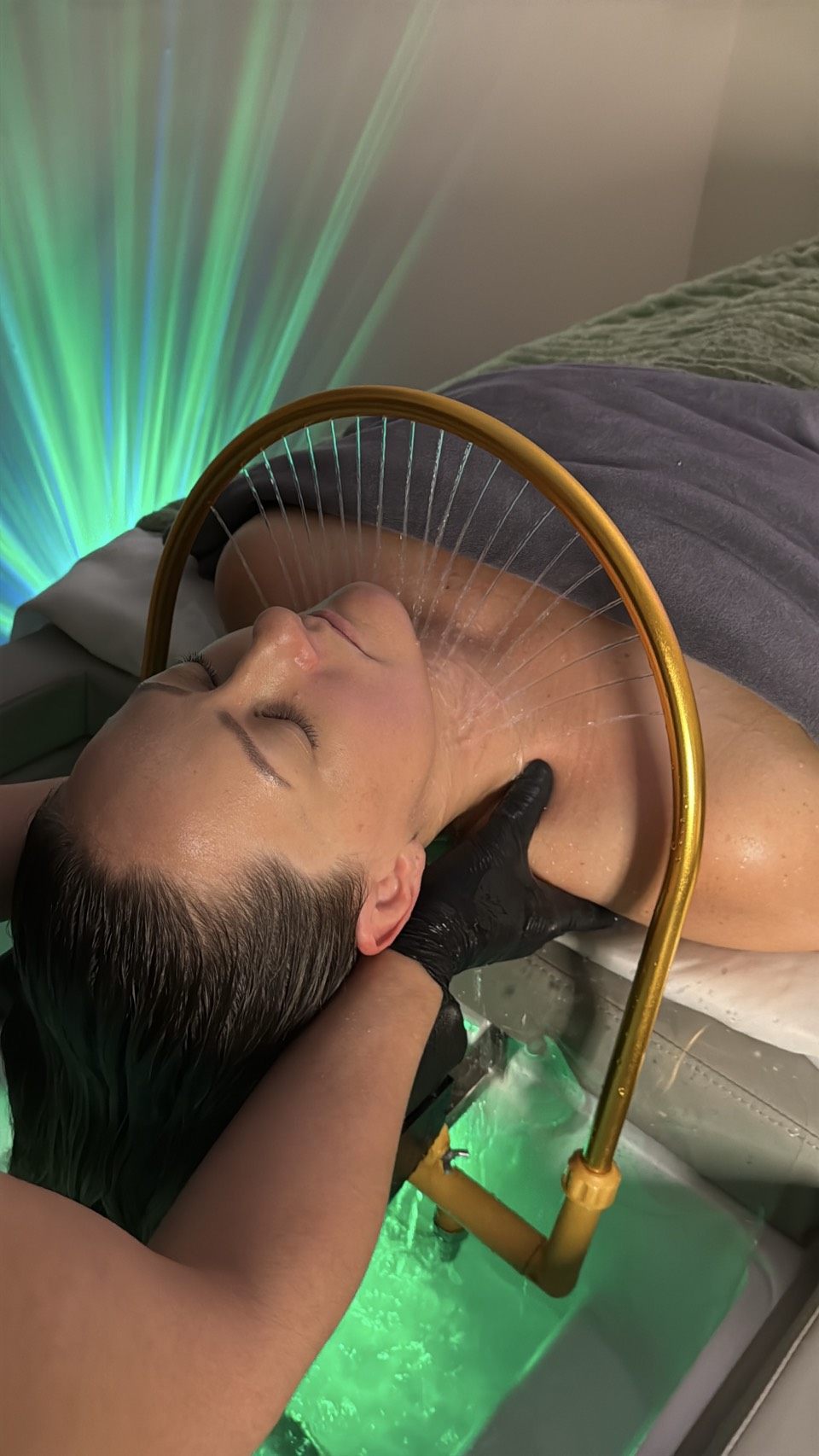 Head Spa treatment in progress with water therapy